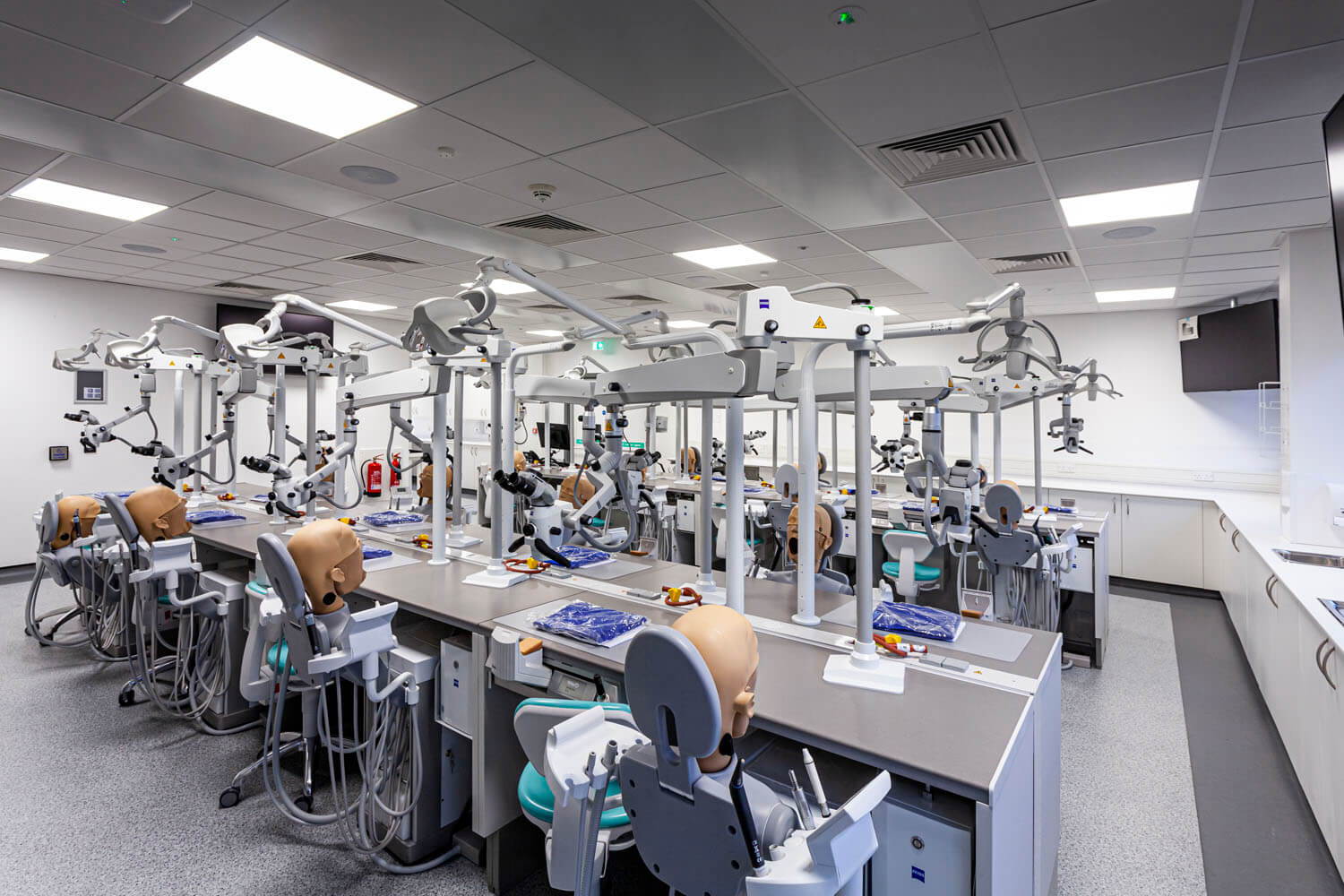 Rows of dental training bays in the new Newcastle University simulation suite, with MEP designed by CAD21