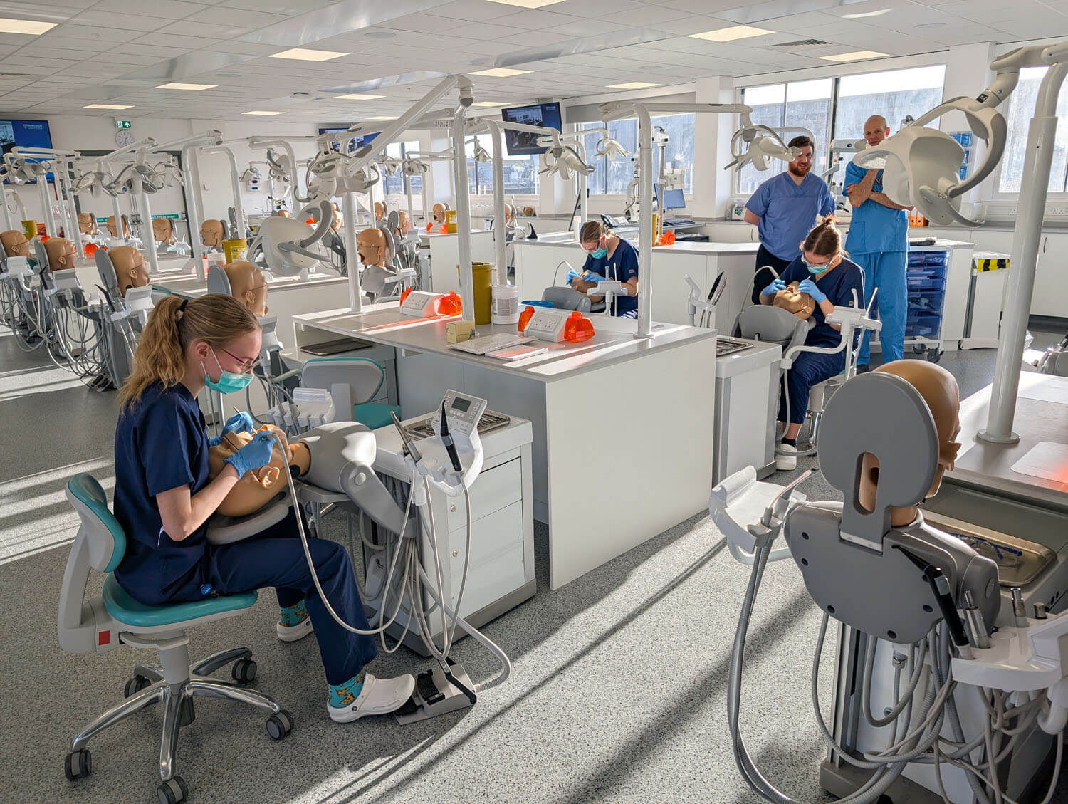 Students working at the dental simulation bays, the finished training suite in use on Level 7